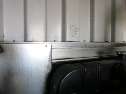 1991 Ford LTD Crown Victoria - Photograph inside a generator enclosure, not a technical document.