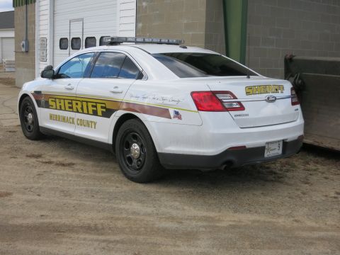 1991 Ford LTD Crown Victoria - Photograph of a Merrimack County Sheriff Ford Taurus patrol car, not a technical document.