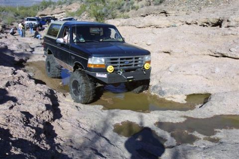 1994 Ford Bronco - This 1994 Ford Bronco is shown off-roading on a challenging rocky course.