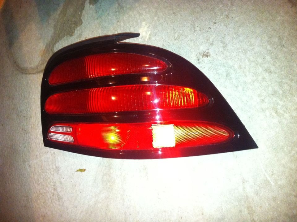 Aftermarket red and clear tail light assembly for a 1994 Ford Bronco