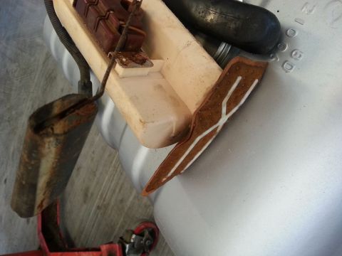 1994 Ford Bronco - Photograph of a fuel tank sending unit and float assembly, not a technical document.