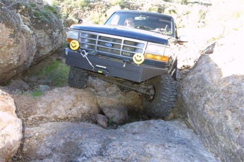 1994 Ford Bronco - This 1994 Ford Bronco is shown off-roading through a challenging rocky path.