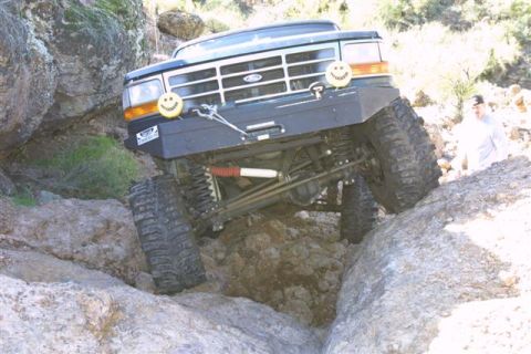 1994 Ford Bronco - Modified Ford Bronco tackling a difficult rocky terrain.