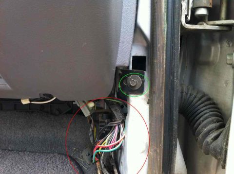 1996 Ford F-150 - Detail shot of the interior of a vehicle, focusing on the door panel and dashboard components.