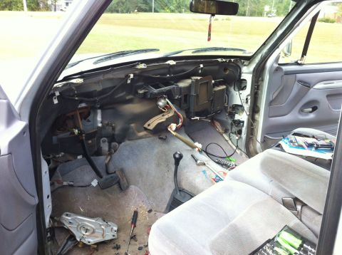 1996 Ford F-150 - Interior view of a disassembled truck dashboard, revealing wiring and HVAC components.
