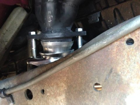 1992 Ford F-150 - Close-up view of an exhaust system component, likely a hanger or mount, showing bolted connections.