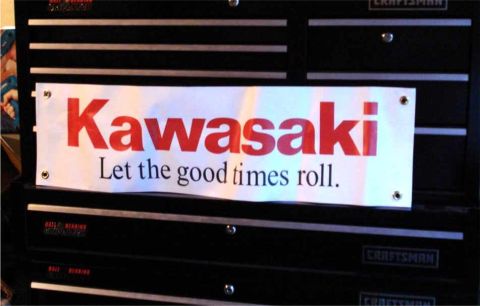 2008 Ford Crown Victoria - A banner advertising Kawasaki is attached to a black Craftsman toolbox.