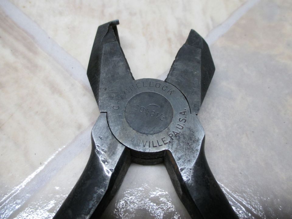 Wire cutters with "J.H. HELLOCK" and "403/2" stamped on the pivot