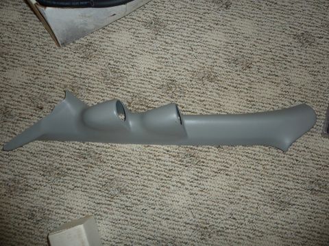 2007 Subaru Impreza - A gray plastic A-pillar gauge pod with two openings is shown on a carpeted surface.