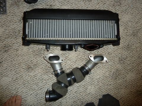 2007 Subaru Impreza - Intercooler and Y-pipe assembly laid out on a carpeted surface.